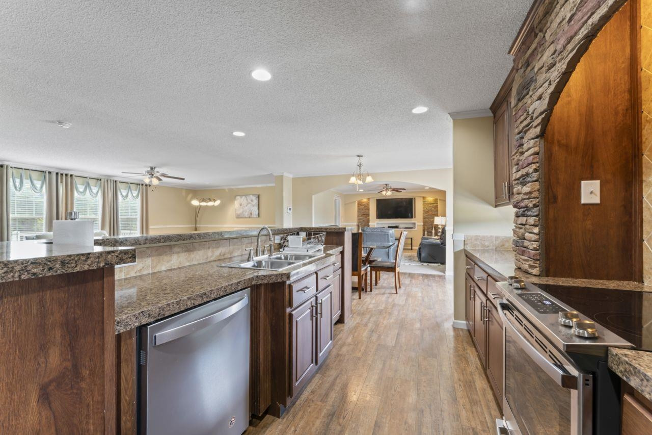 161 Mulchi Road Norlina, NC 27563 - Photo 17 of 38 a kitchen with stainless steel appliances granite countertop a stove oven and a refrigerator
