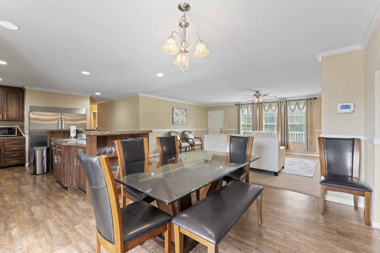 161 Mulchi Road Norlina, NC 27563 - Photo 19 of 38 a view of a dining room with furniture window and wooden floor