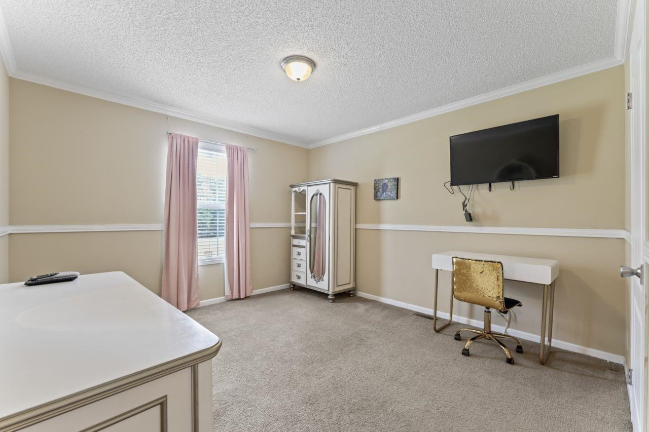 161 Mulchi Road Norlina, NC 27563 - Photo 23 of 38 a room with furniture and a flat screen tv