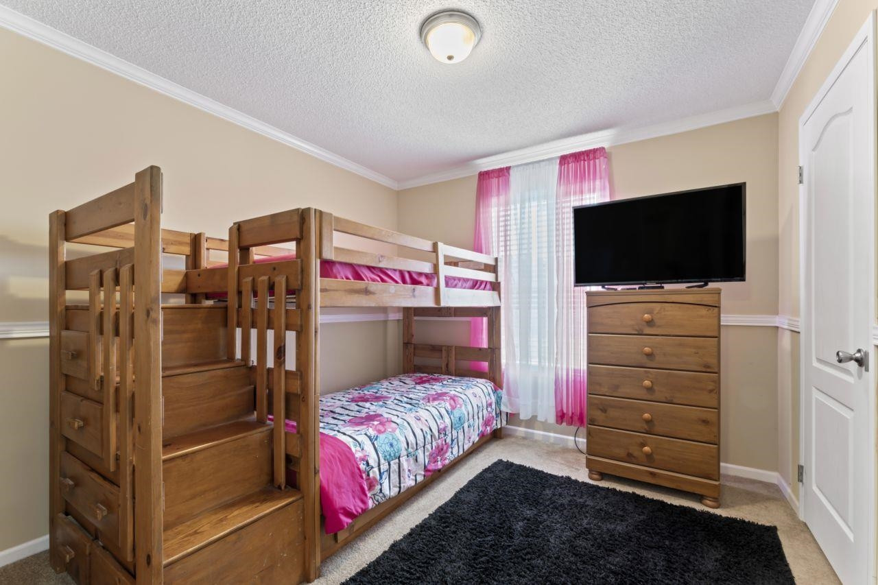 161 Mulchi Road Norlina, NC 27563 - Photo 24 of 38 a bedroom with a bed and a flat screen tv