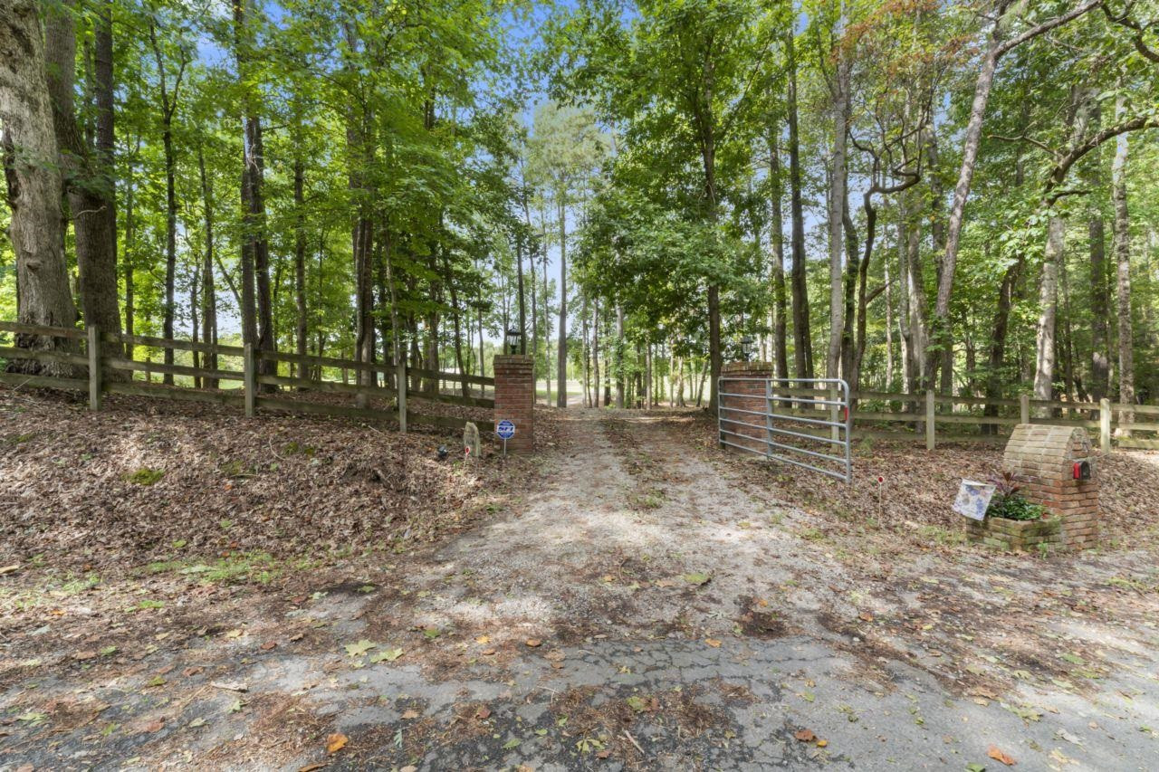 161 Mulchi Road Norlina, NC 27563 - Photo 3 of 38 a backyard of a house with lots of green space