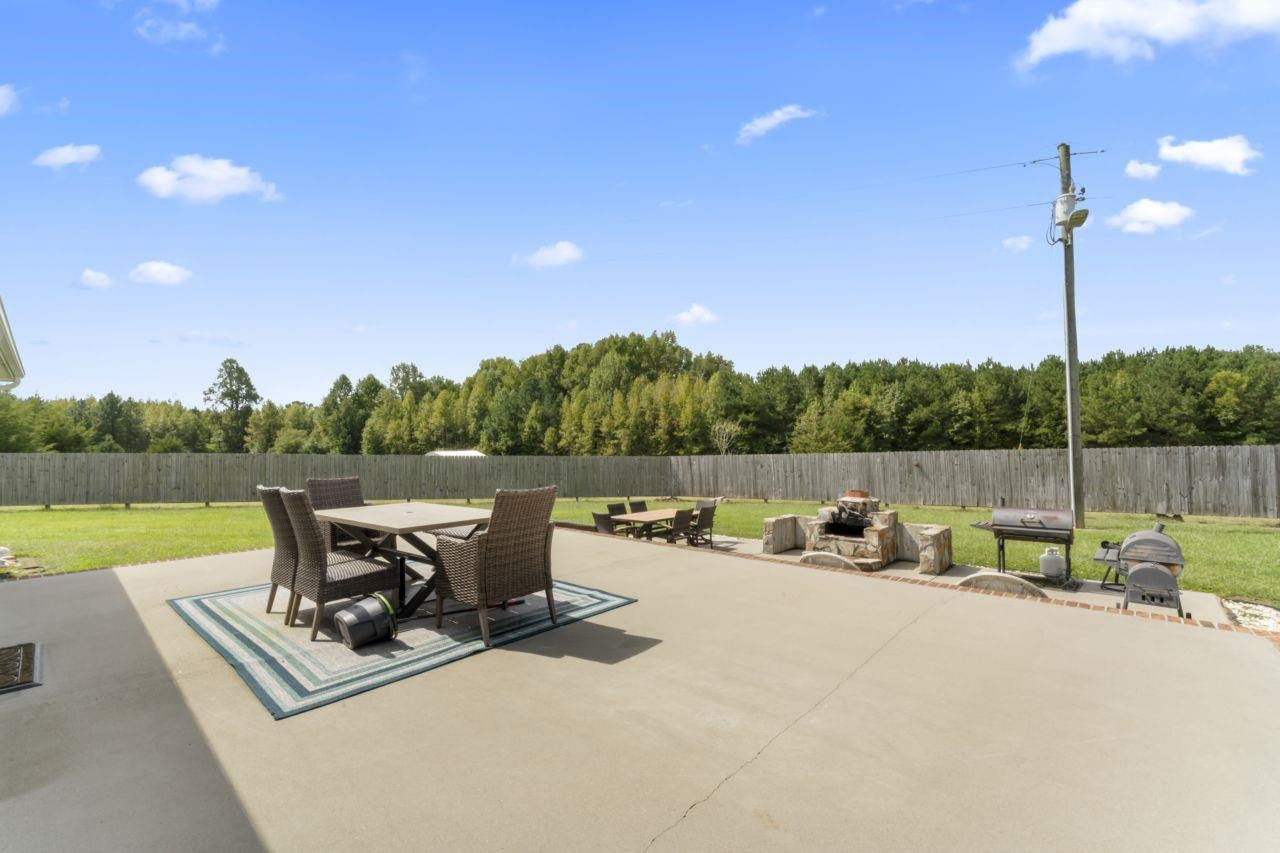 161 Mulchi Road Norlina, NC 27563 - Photo 33 of 38 a view of a terrace with sitting area and lake view
