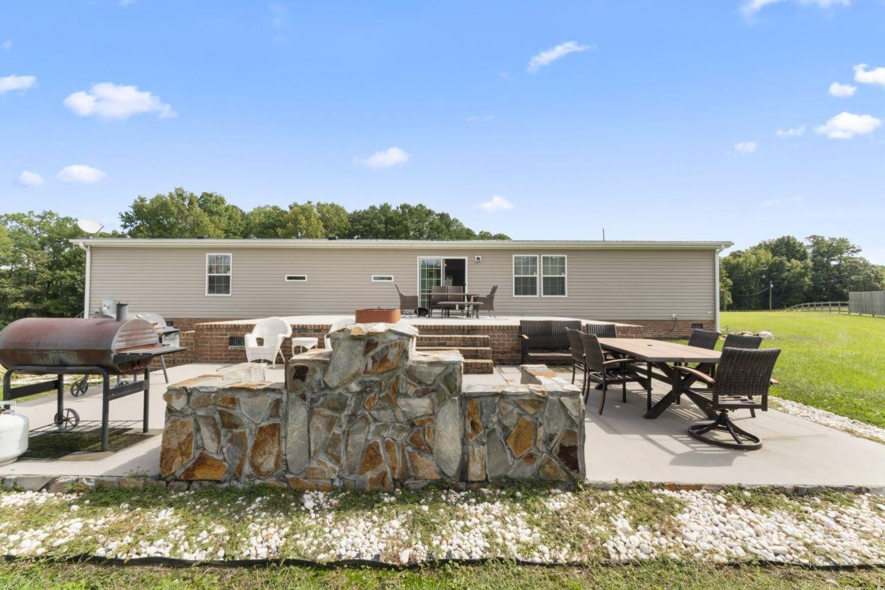 161 Mulchi Road Norlina, NC 27563 - Photo 34 of 38 a view of a terrace with chairs and potted plants