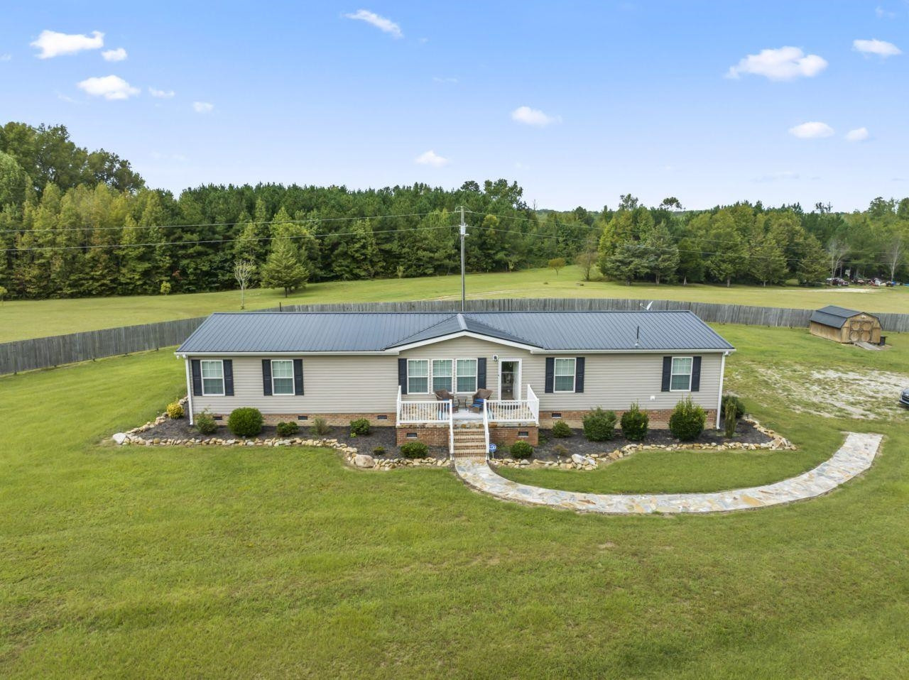 161 Mulchi Road Norlina, NC 27563 - Photo 35 of 38 a front view of a house with garden