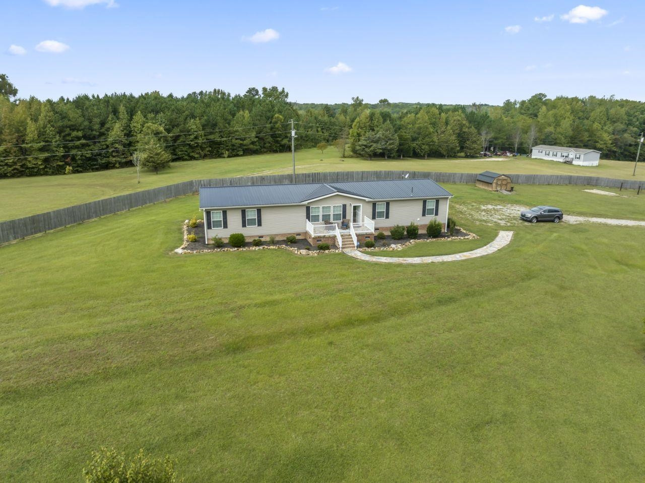 161 Mulchi Road Norlina, NC 27563 - Photo 36 of 38 a view of a lake with big yard and large trees