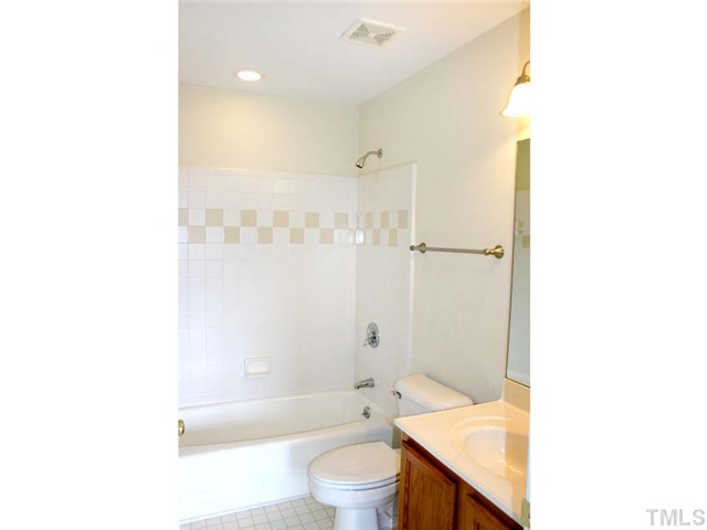 3225 Henderson Field Road Mebane, NC 27302 - Photo 17 of 21 Hall Bath upstairs serves other 2 bedrooms and features tiled tub/shower surround.
