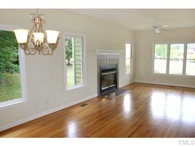 3225 Henderson Field Road Mebane, NC 27302 - Photo 5 of 21 This view is from the Dining end looking into the Family Room with triple windows at front. If preferred, this can be one extra large living space, as there is another Dinign area in the Kitchen.