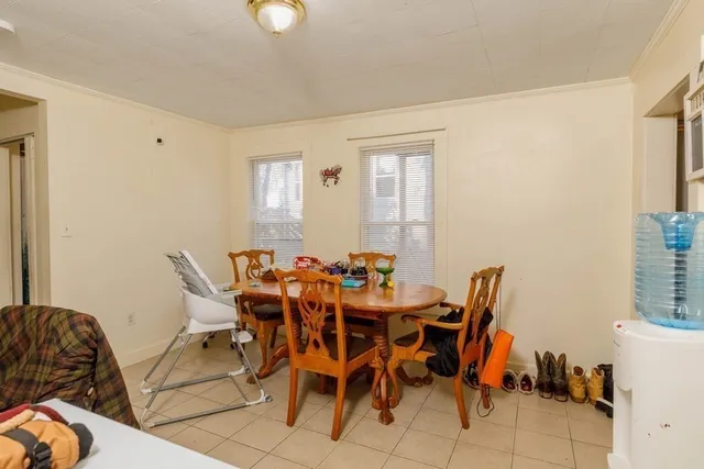 a bedroom with furniture and a flat screen tv