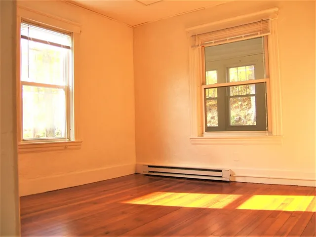 a bath tub sitting next to a white toilet