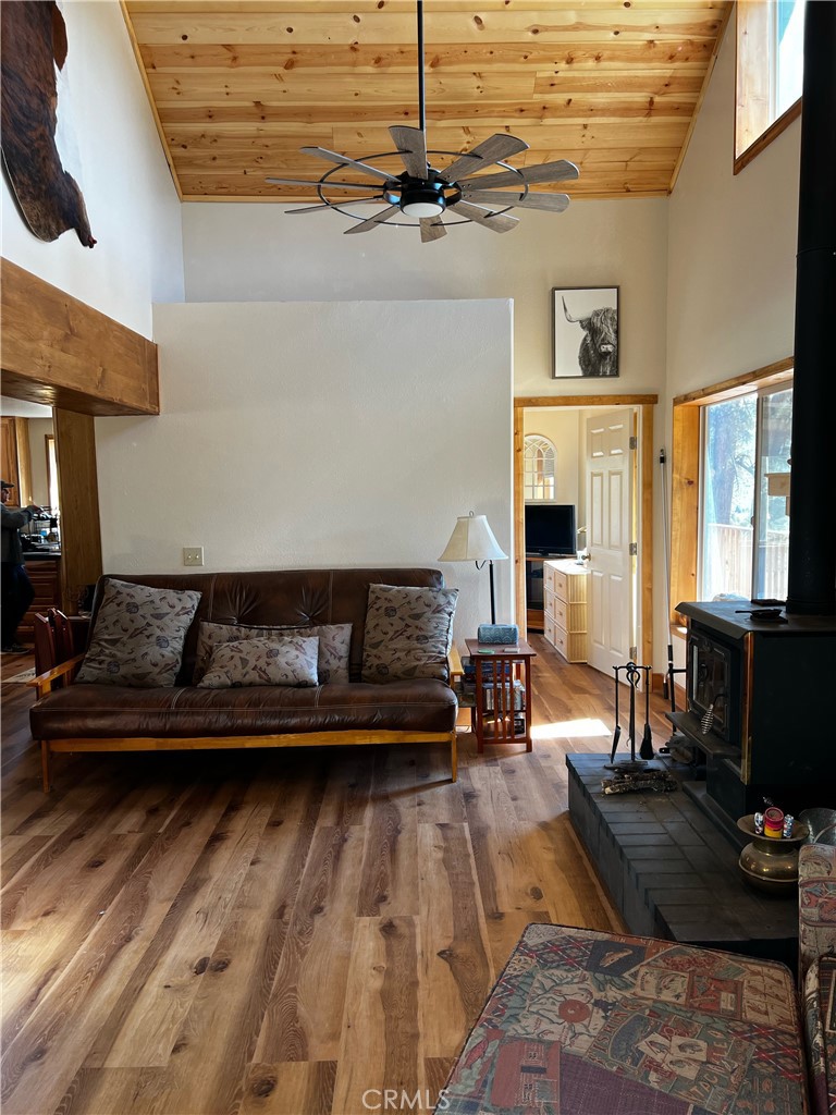 98443 Sierra Meadow Road Inyokern, CA 93527 - Photo 17 of 62 a living room with furniture and a fireplace