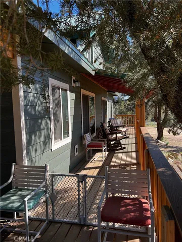 a view of a patio with table and chairs and potted plants