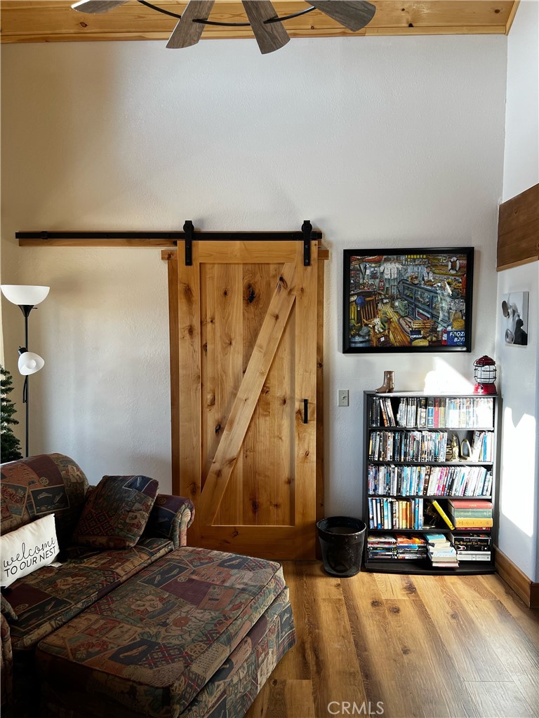 98443 Sierra Meadow Road Inyokern, CA 93527 - Photo 24 of 62 a living room with furniture and a flat screen tv