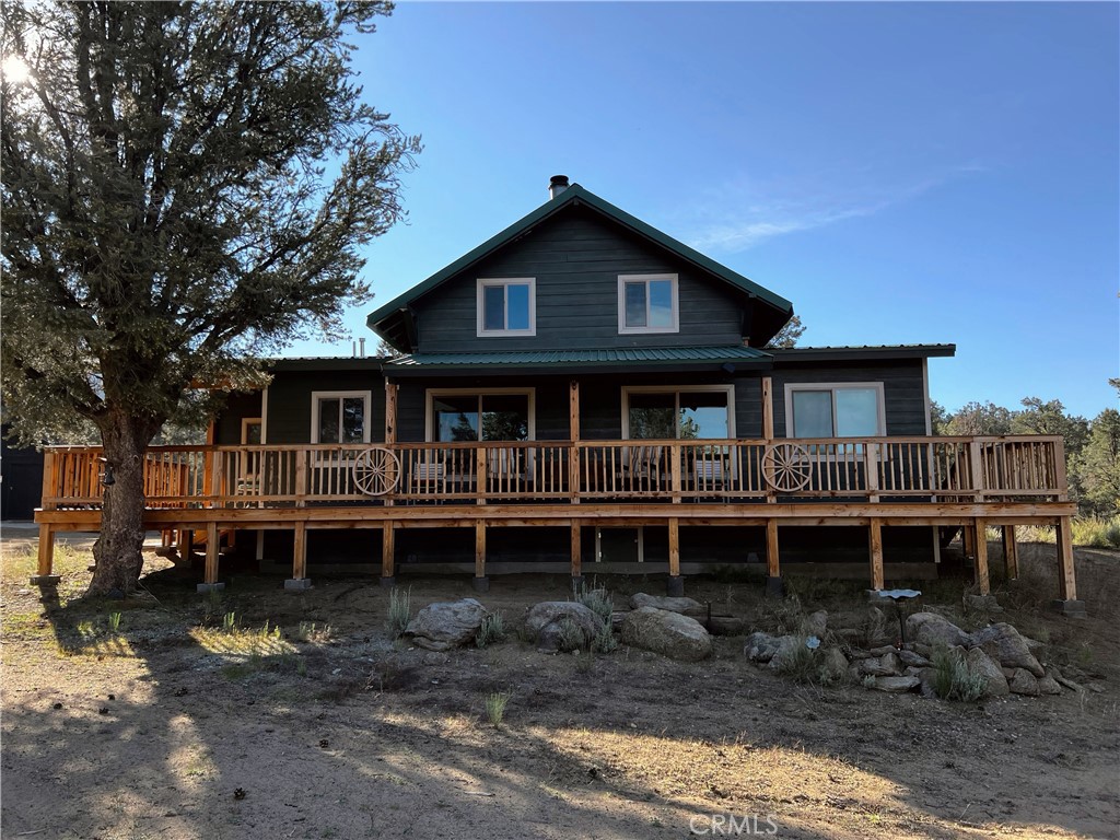 98443 Sierra Meadow Road Inyokern, CA 93527 - Photo 29 of 62 a front view of a house with a yard