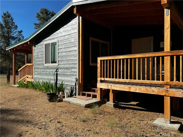 a view of balcony with wooden floor