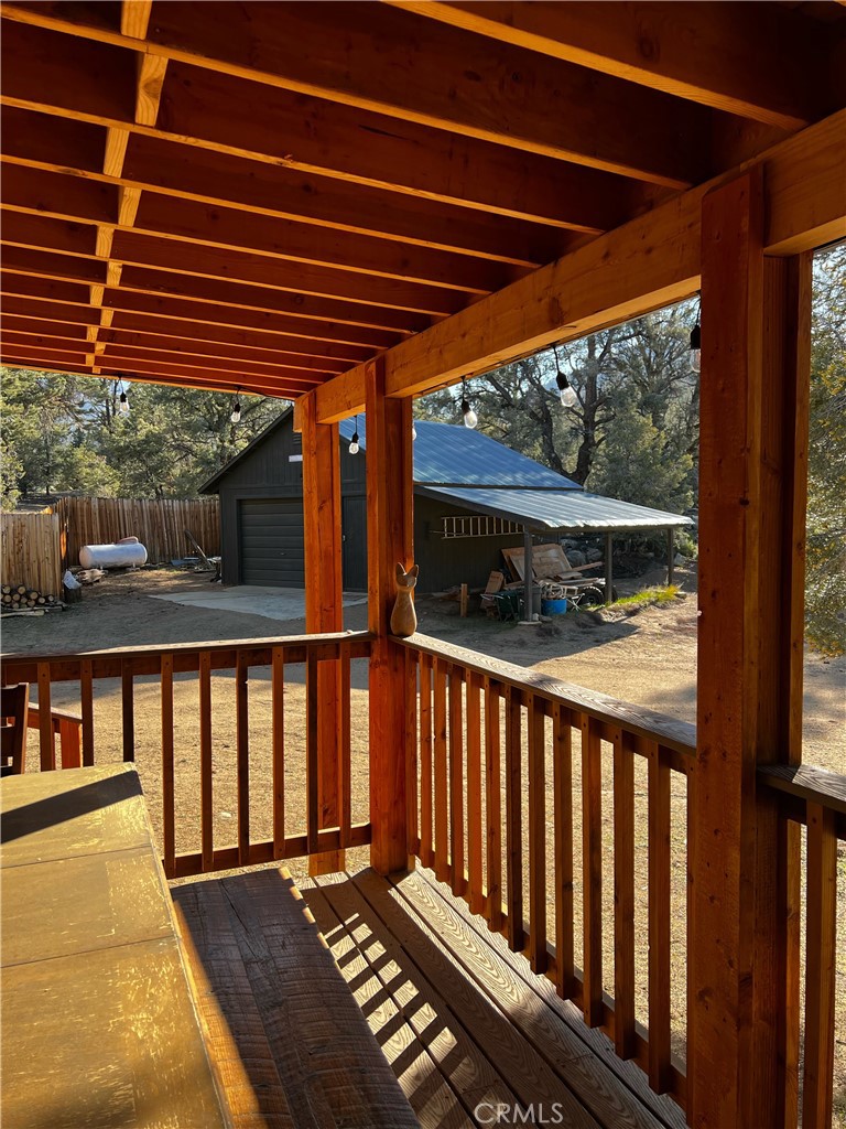 98443 Sierra Meadow Road Inyokern, CA 93527 - Photo 36 of 62 a view of balcony with wooden floor and outdoor space