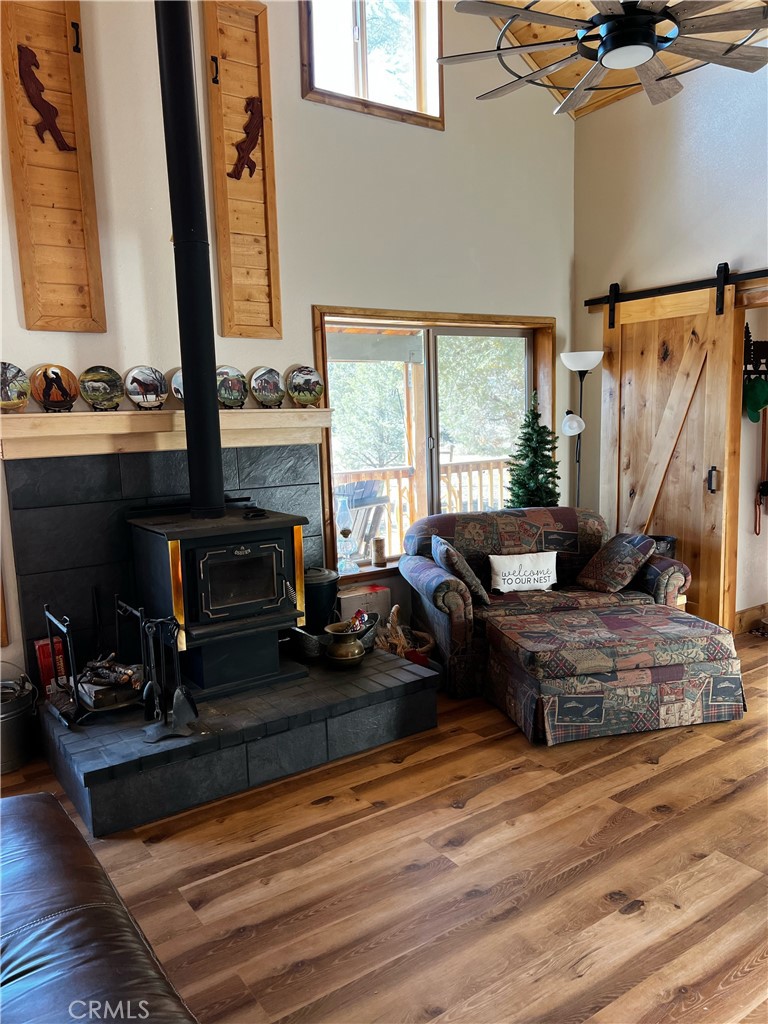 98443 Sierra Meadow Road Inyokern, CA 93527 - Photo 6 of 62 a living room with furniture fireplace and a large window