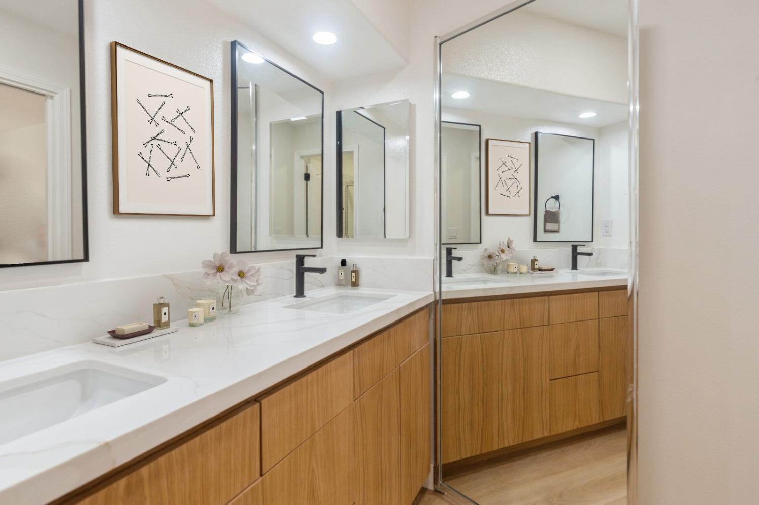 987 Asilomar Terrace, Unit 2 Sunnyvale, CA 94086 - Photo 12 of 48 a bathroom with double vanity sinks and a mirror