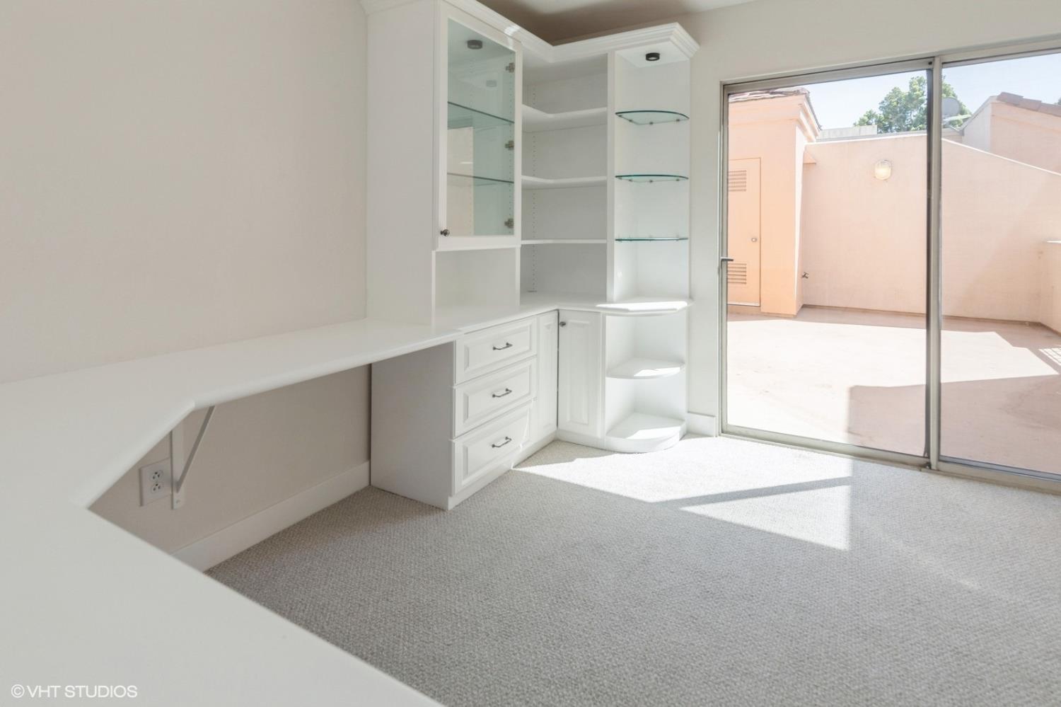 987 Asilomar Terrace, Unit 2 Sunnyvale, CA 94086 - Photo 43 of 48 a view of an empty room with cabinet and window
