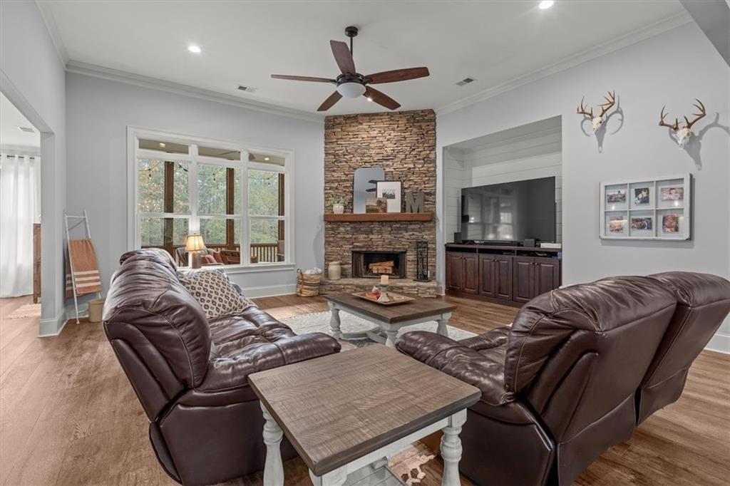 5330 North Helton Road Winston, GA 30187 - Photo 14 of 65 a living room with furniture a fireplace and a flat screen tv
