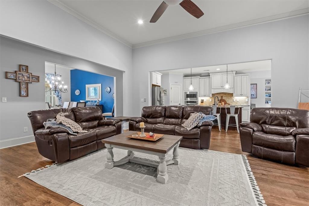 5330 North Helton Road Winston, GA 30187 - Photo 16 of 65 a living room with furniture a rug kitchen view and a window