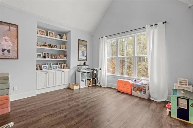 a balcony with furniture and a large window