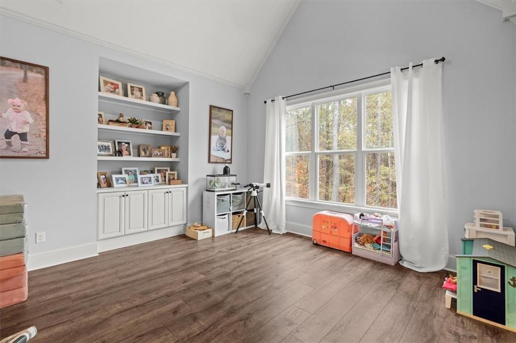 5330 North Helton Road Winston, GA 30187 - Photo 24 of 65 a bedroom with furniture and a wooden floor