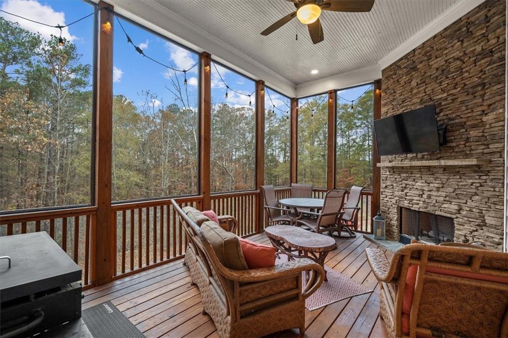 5330 North Helton Road Winston, GA 30187 - Photo 26 of 65 a living room with furniture a flat screen tv and a fireplace