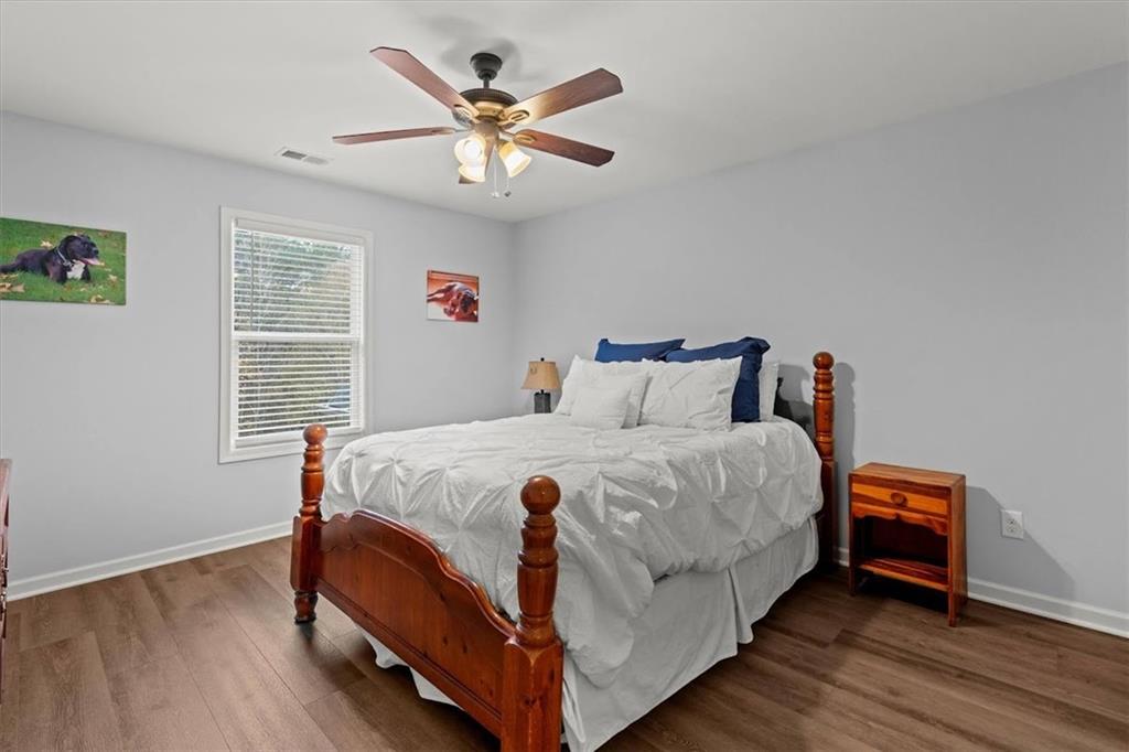 5330 North Helton Road Winston, GA 30187 - Photo 38 of 65 a large bed sitting in a bedroom next to a window