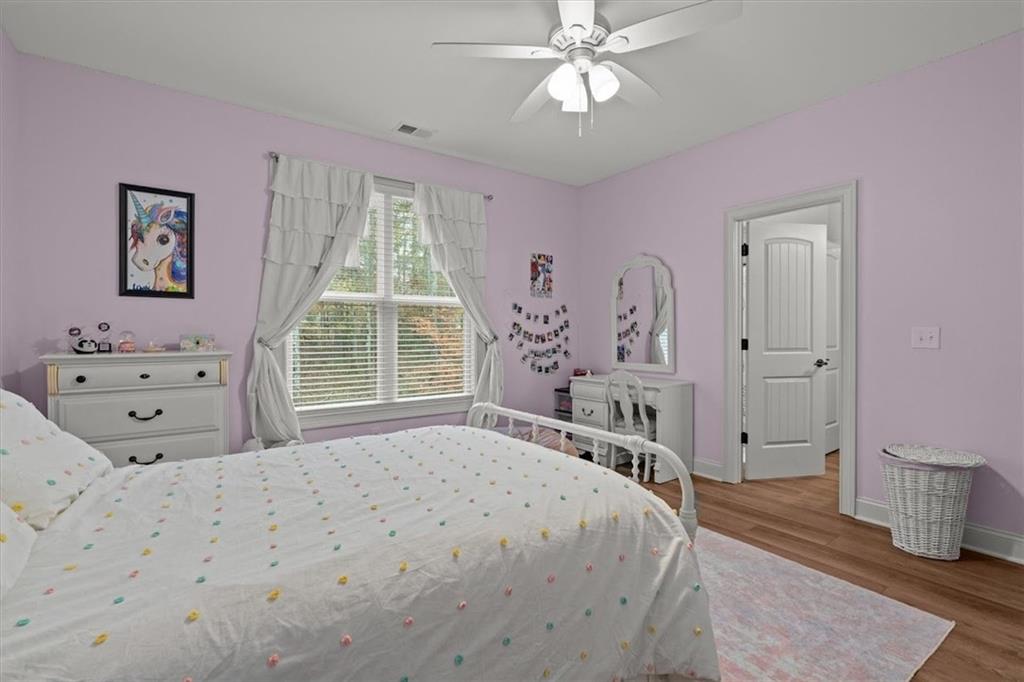 5330 North Helton Road Winston, GA 30187 - Photo 40 of 65 a bedroom with a large bed and a window