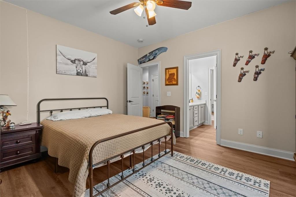 5330 North Helton Road Winston, GA 30187 - Photo 43 of 65 a bedroom with a bed and a chandelier