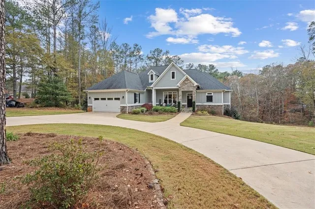a front view of a house with outdoor seating