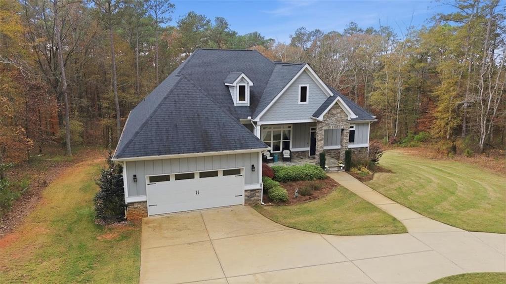 5330 North Helton Road Winston, GA 30187 - Photo 57 of 65 a aerial view of a house next to a yard with plants and large trees
