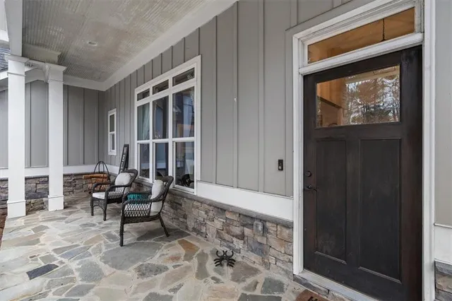 a view of a dining room with furniture wooden floor and chandelier