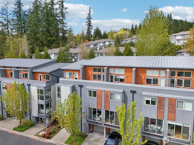 a view of a brick building next to a yard
