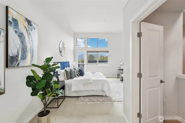 a living room with furniture potted plant and a window