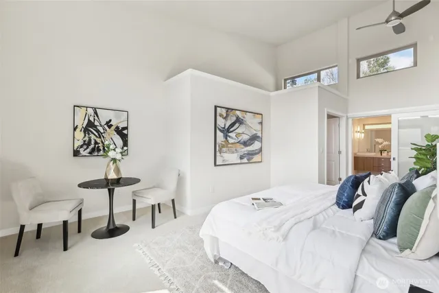 a bedroom with a bed and a chair