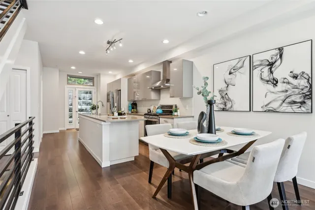 a kitchen with a table and chairs in it