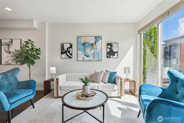 a living room with furniture and a large window