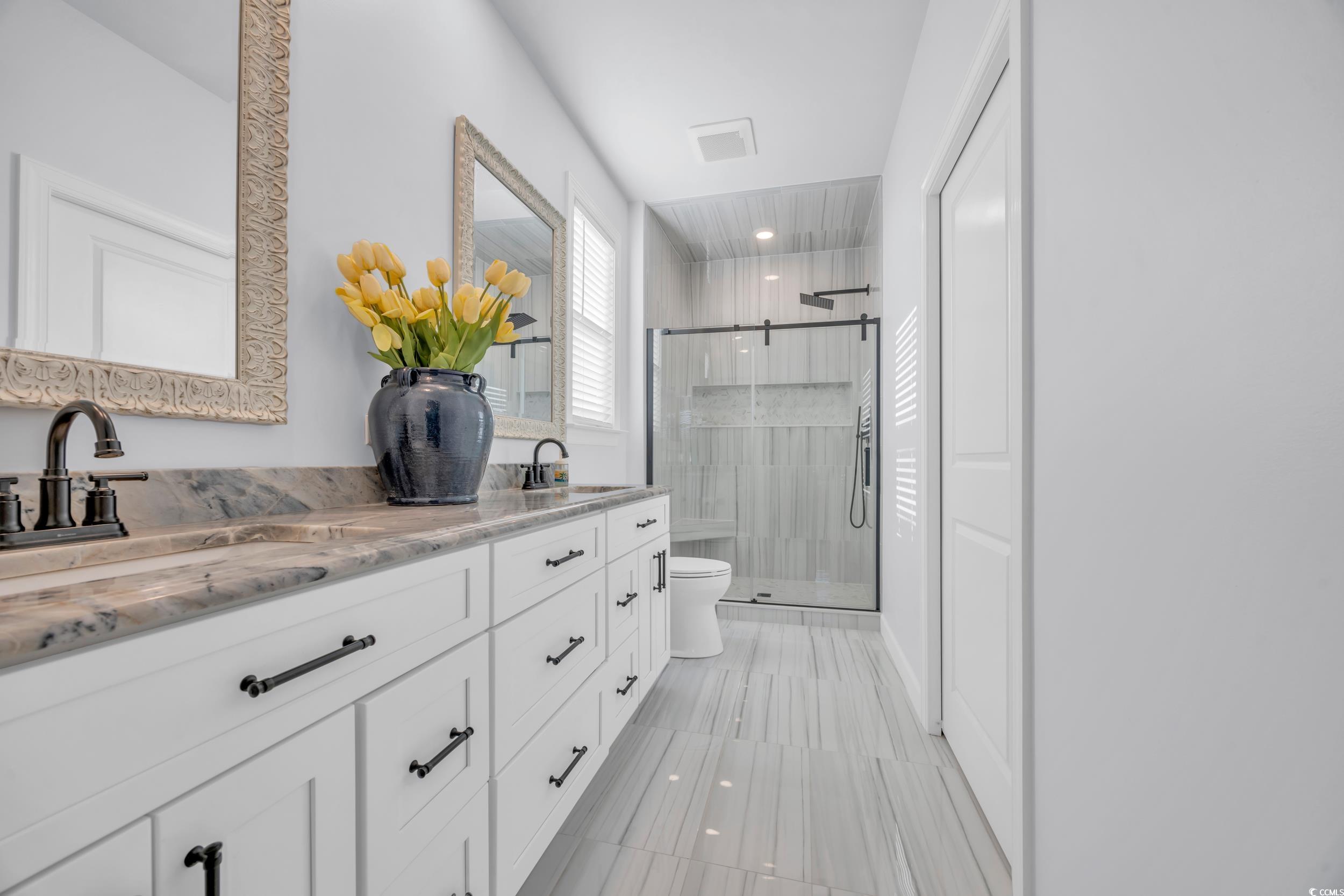 2653 Orion Loop Myrtle Beach, SC 29577 - Photo 14 of 39 Bathroom featuring a stall shower, double vanity,