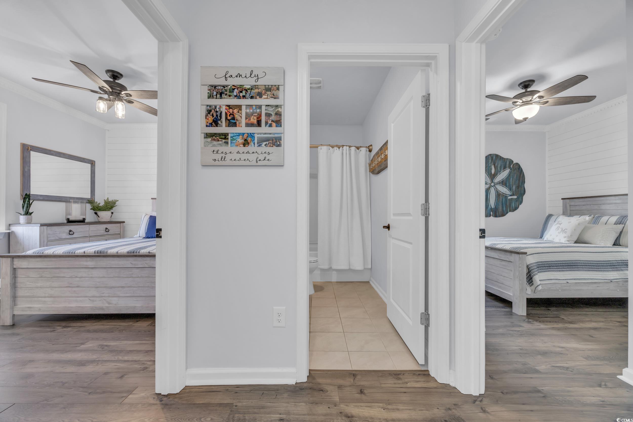 2653 Orion Loop Myrtle Beach, SC 29577 - Photo 21 of 39 Bedroom featuring a ceiling fan, wood finished flo