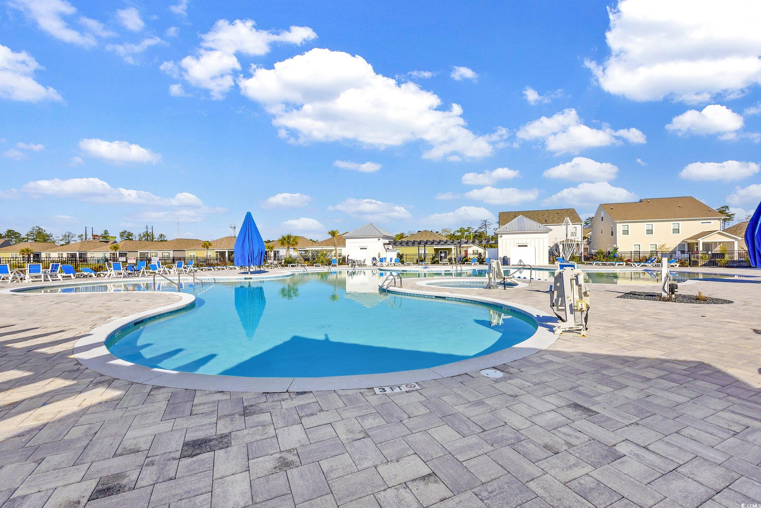 2653 Orion Loop Myrtle Beach, SC 29577 - Photo 34 of 39 Community pool with a patio and a residential view