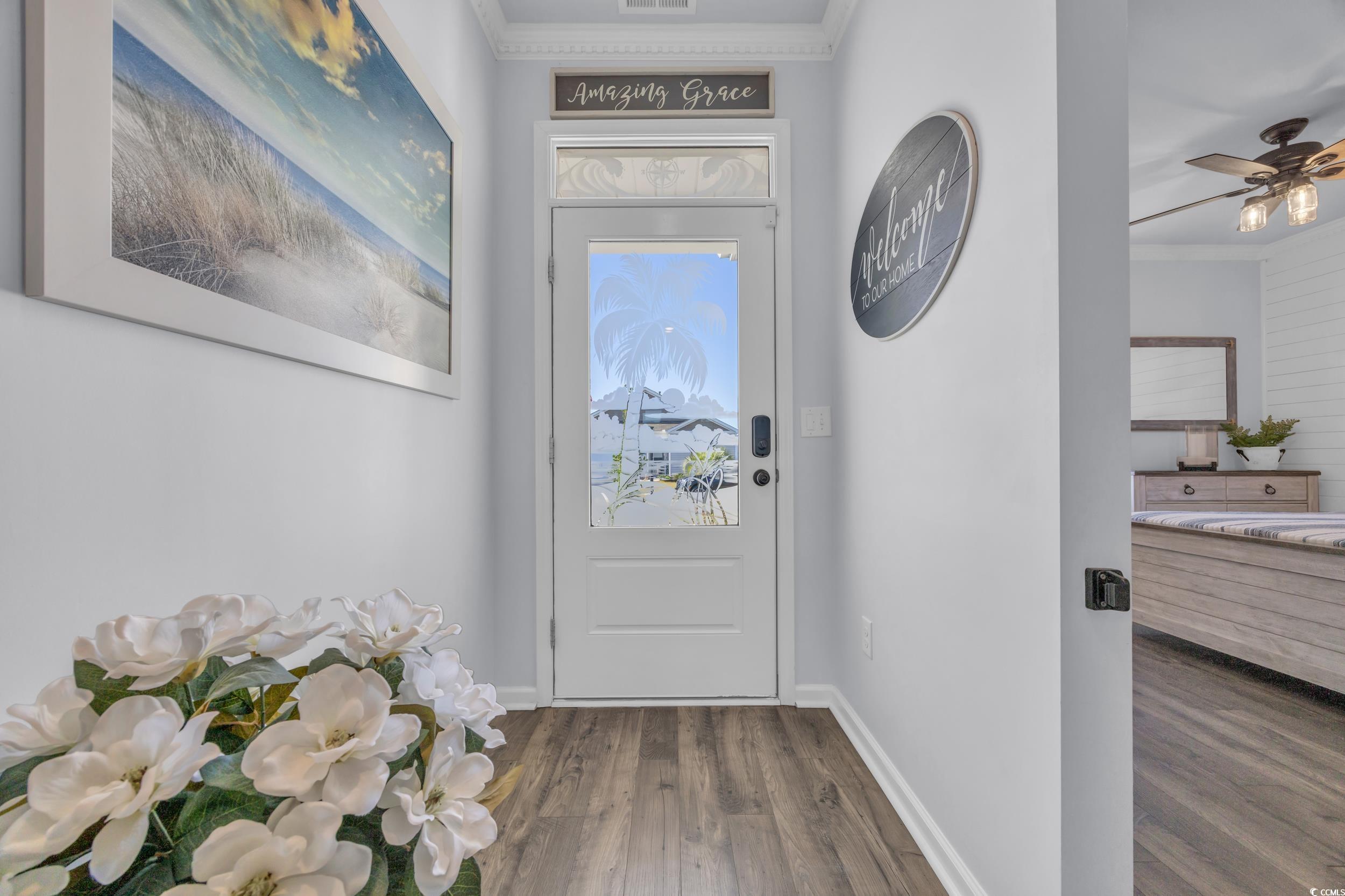 2653 Orion Loop Myrtle Beach, SC 29577 - Photo 5 of 39 Entryway featuring wood finished floors, crown mol