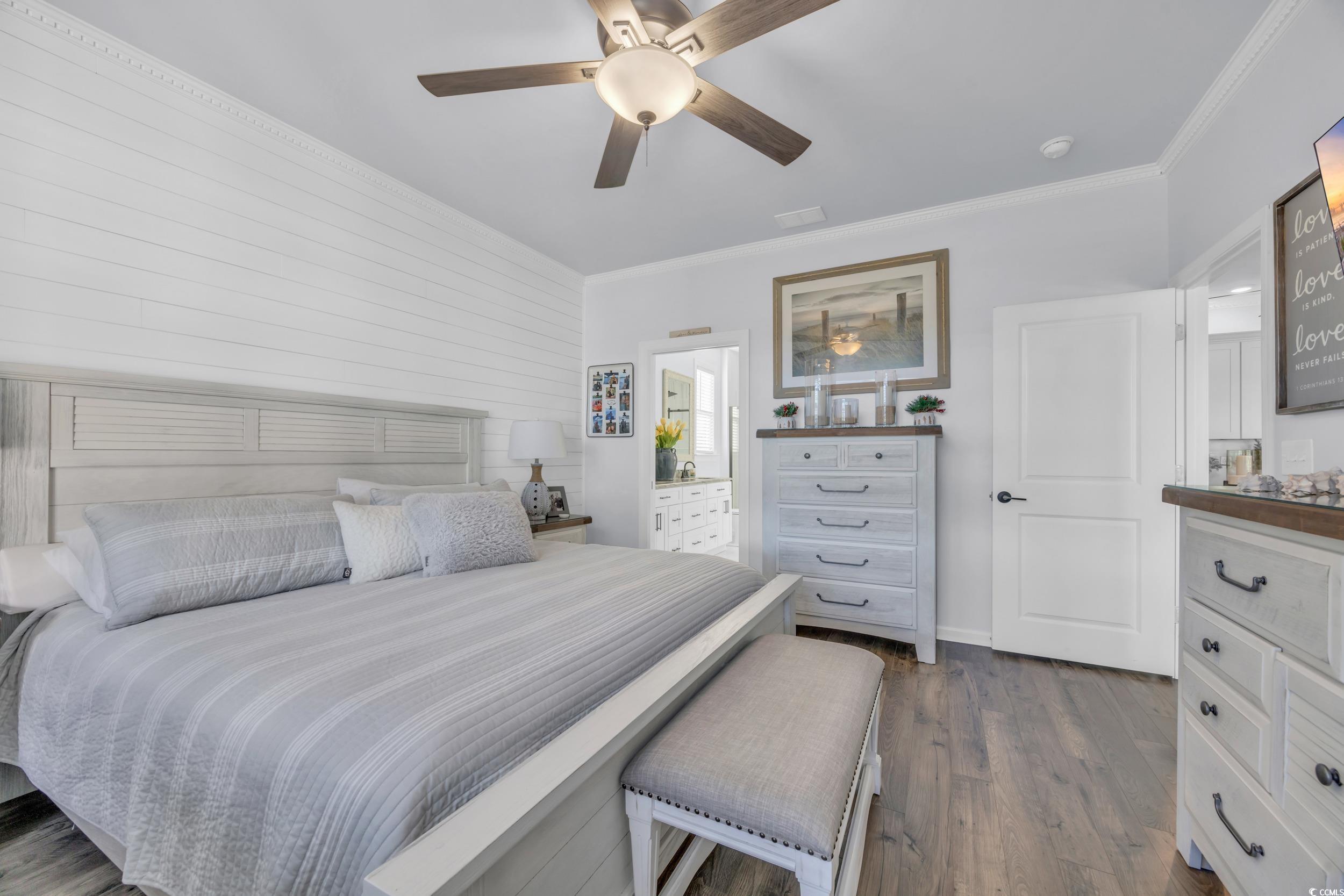 2653 Orion Loop Myrtle Beach, SC 29577 - Photo 10 of 39 Bedroom with ornamental molding, dark wood-type fl