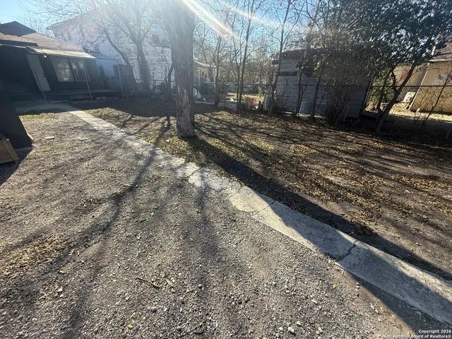 a view of a backyard of the house