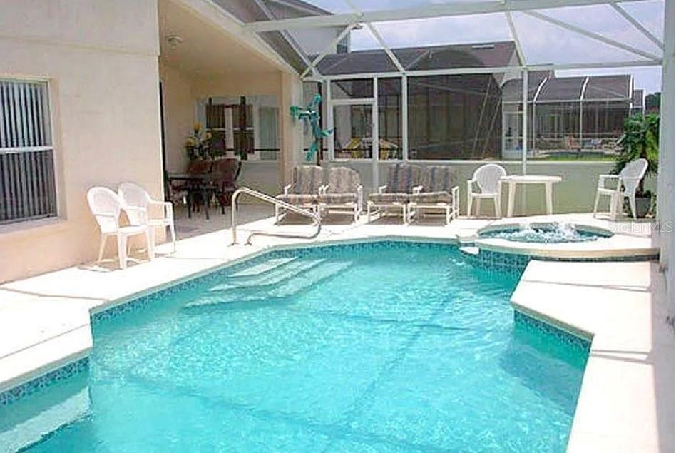 683 Eagle Pointe South Kissimmee, FL 34746 - Photo 4 of 6 a living room with furniture and a yard