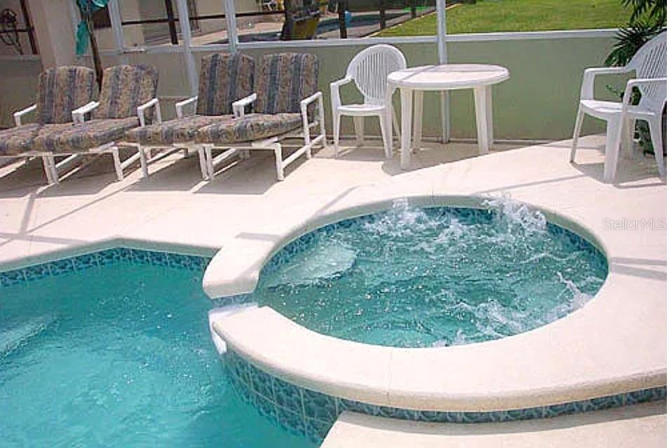 683 Eagle Pointe South Kissimmee, FL 34746 - Photo 6 of 6 a view of a swimming pool with outdoor seating