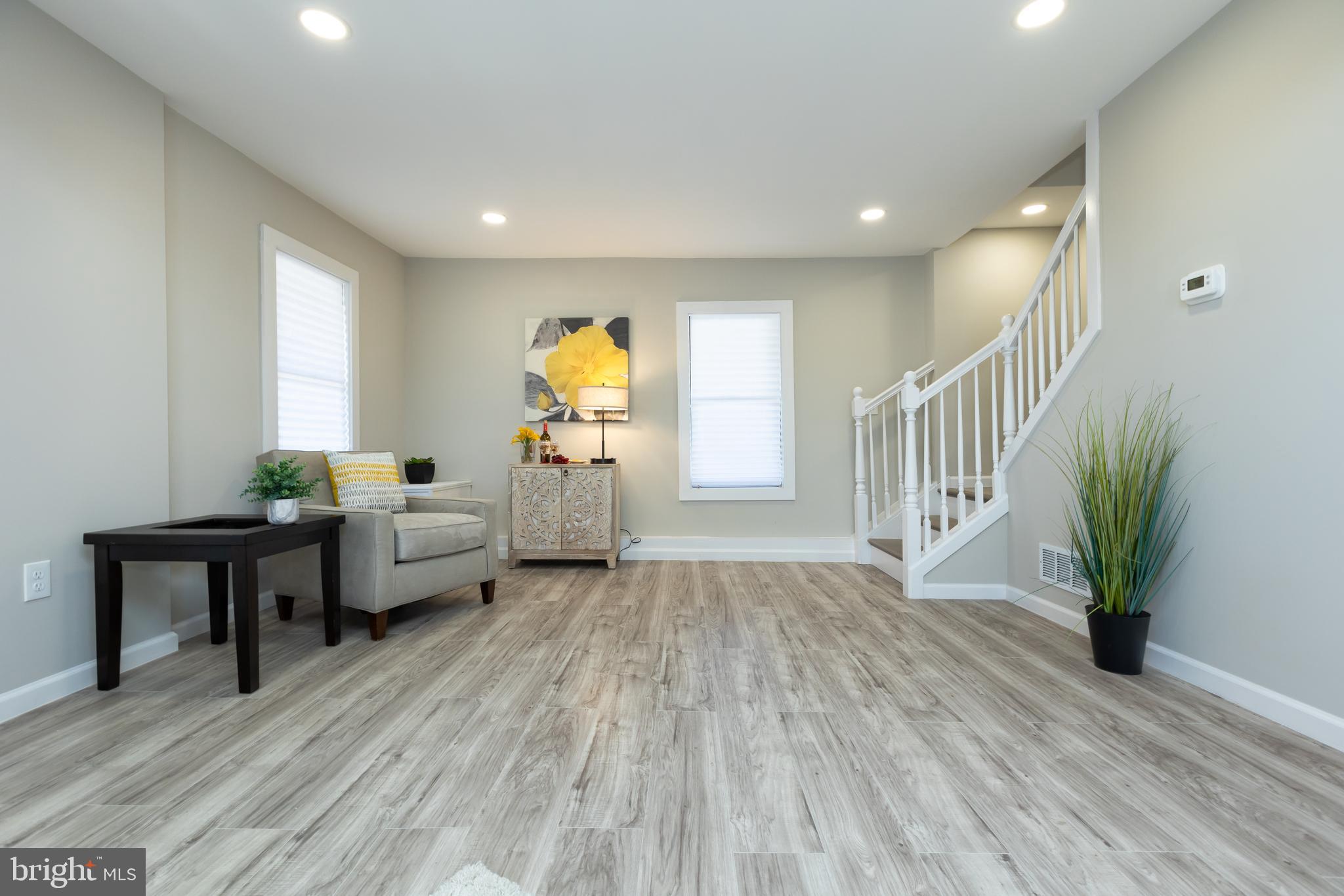 2407 Hammonds Ferry Road Halethorpe, MD 21227 - Photo 15 of 43 a living room with furniture and a wooden floor