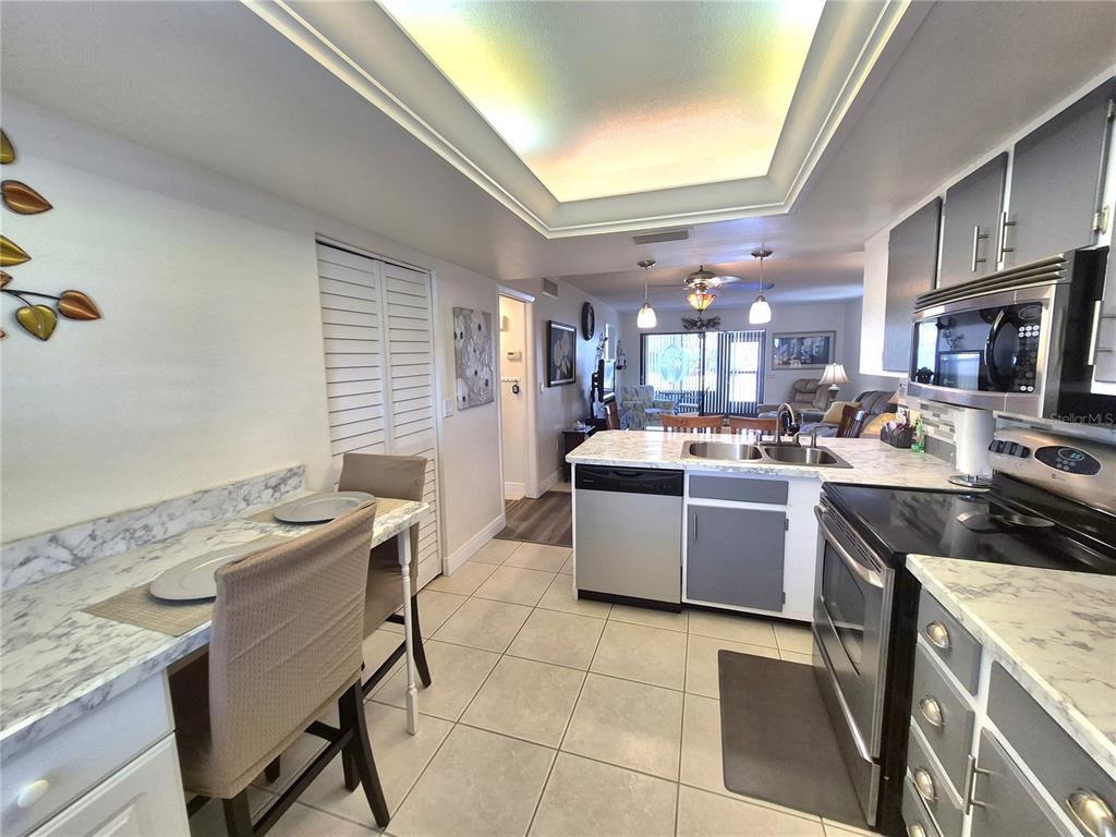 107 Windward Place, Unit 107 Oldsmar, FL 34677 - Photo 18 of 34 a kitchen with a sink cabinets and window