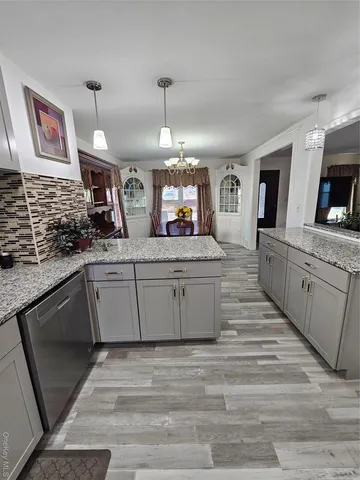 a kitchen with a sink and a refrigerator