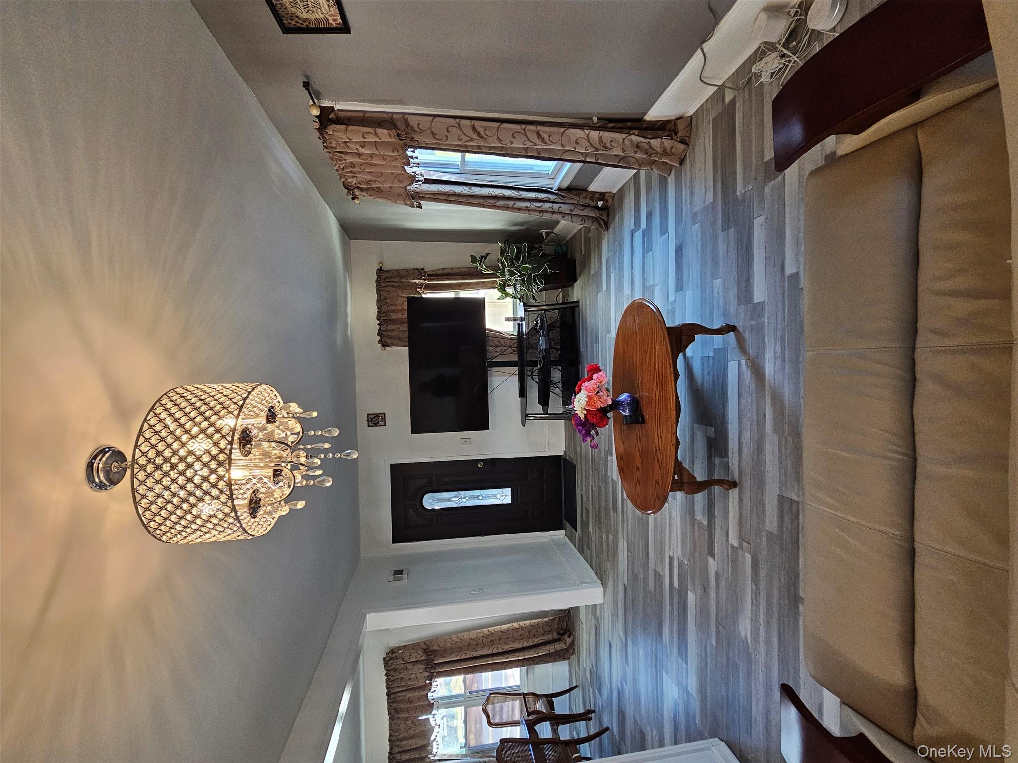 88 Innis Avenue Poughkeepsie, NY 12601 - Photo 19 of 33 a living room with furniture and a flat screen tv